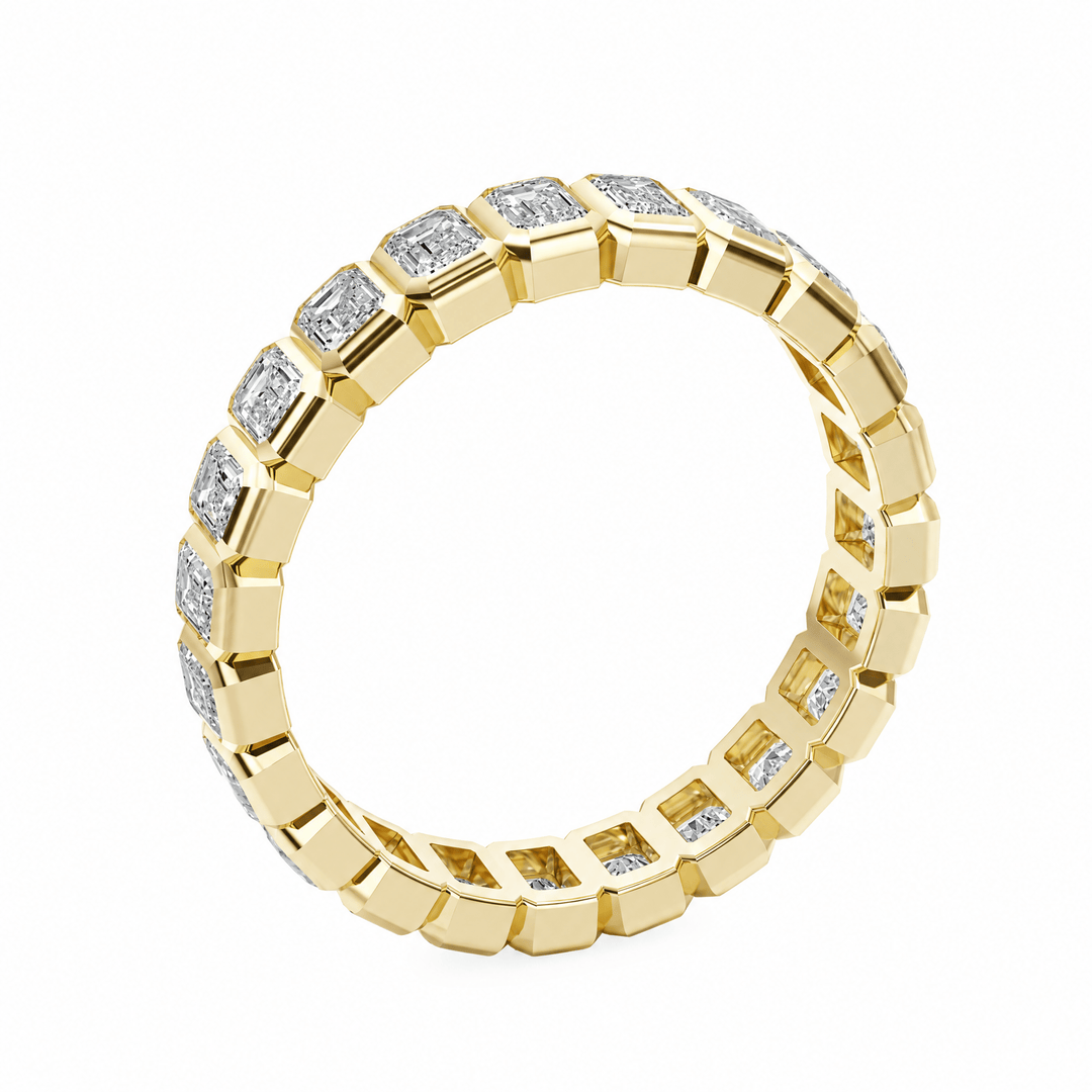 Emerald Bezel Eternity Wedding Band in Wedding Bands by 18 KARATS INC.