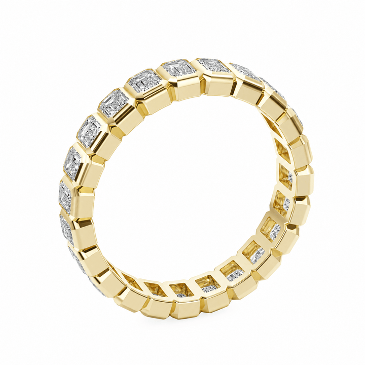 Emerald Bezel Eternity Wedding Band in Wedding Bands by 18 KARATS INC.