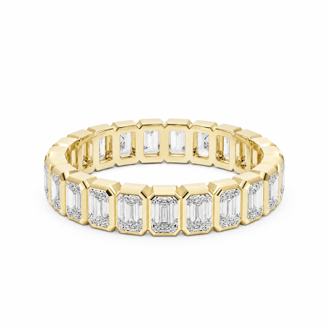 Emerald Bezel Eternity Wedding Band in Wedding Bands by 18 KARATS INC.
