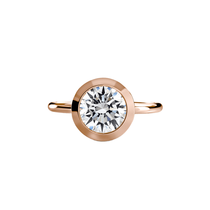 The Bezel Set Solitaire in setting by 18 KARATS