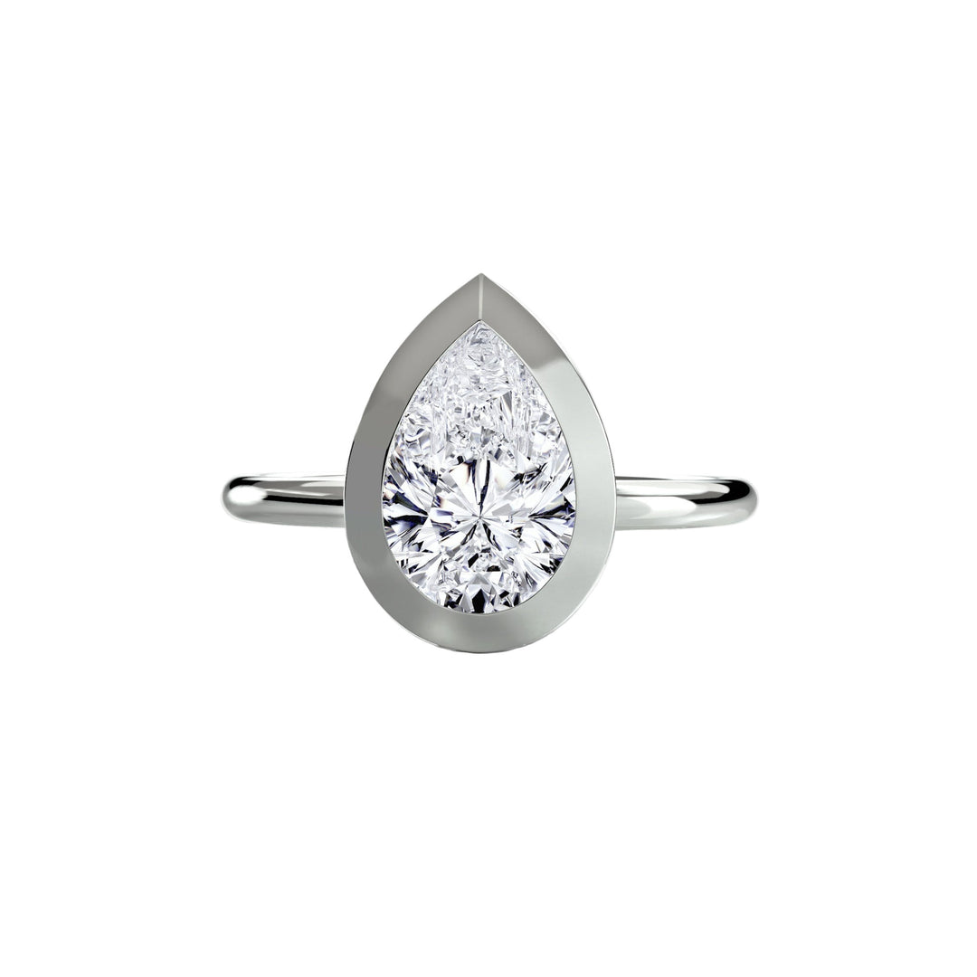 The Bezel Set Solitaire in setting by 18 KARATS