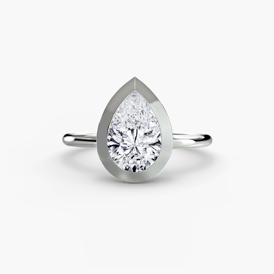 The Bezel Set Solitaire in setting by 18 KARATS