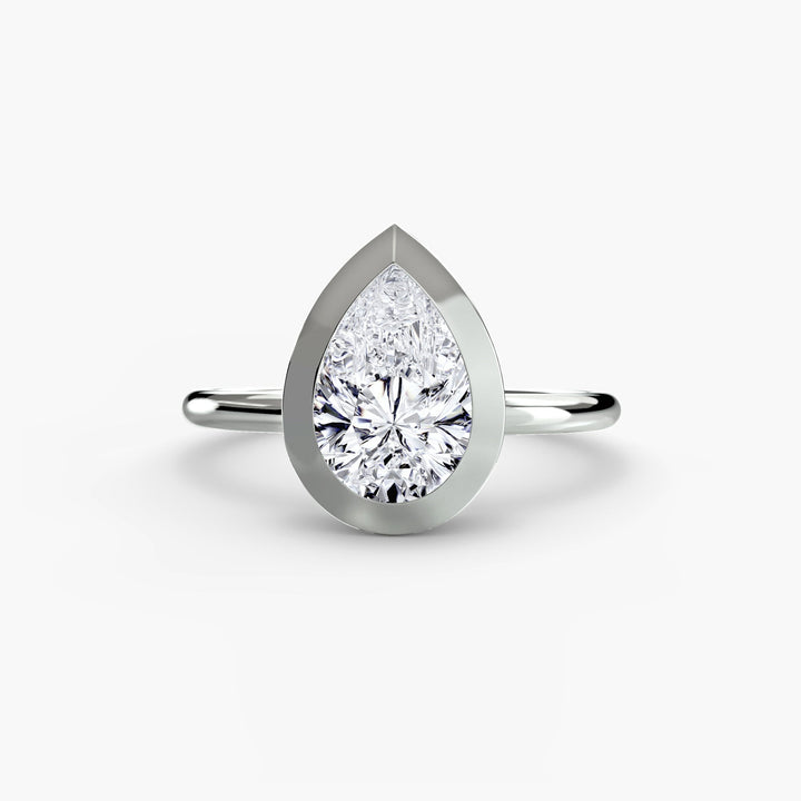 The Bezel Set Solitaire in setting by 18 KARATS