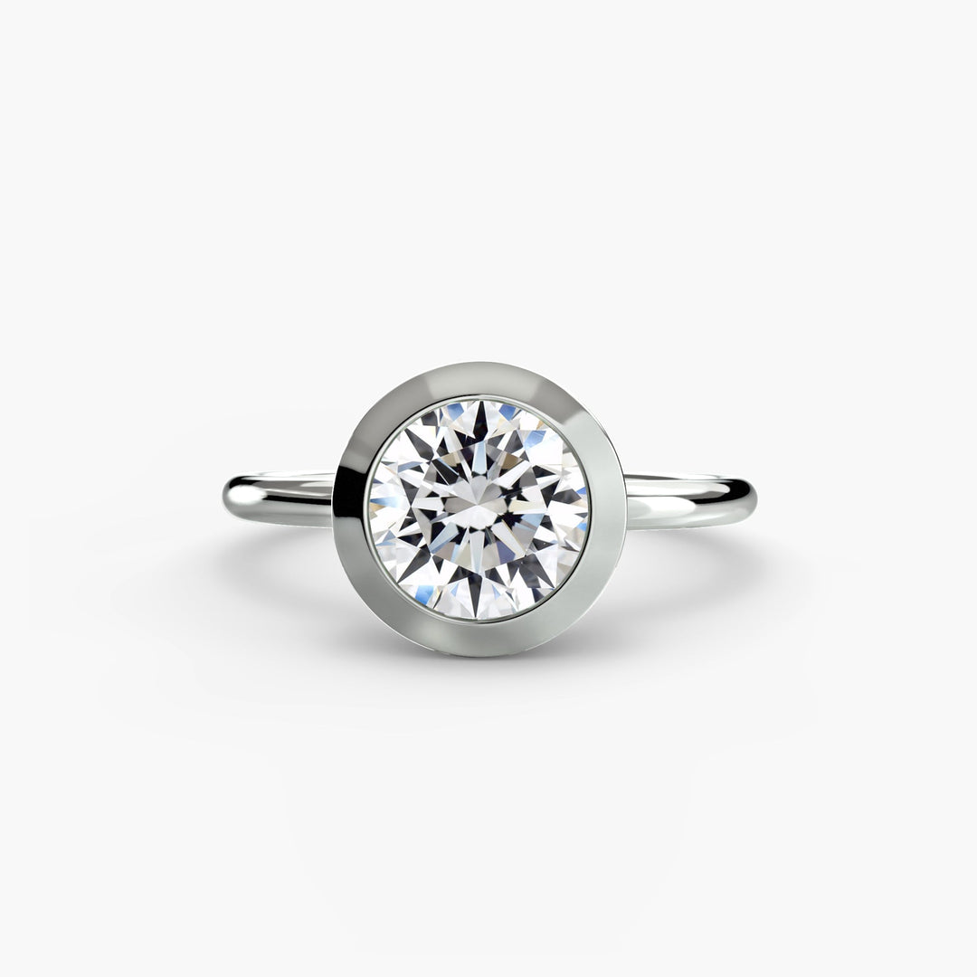 The Bezel Set Solitaire in setting by 18 KARATS