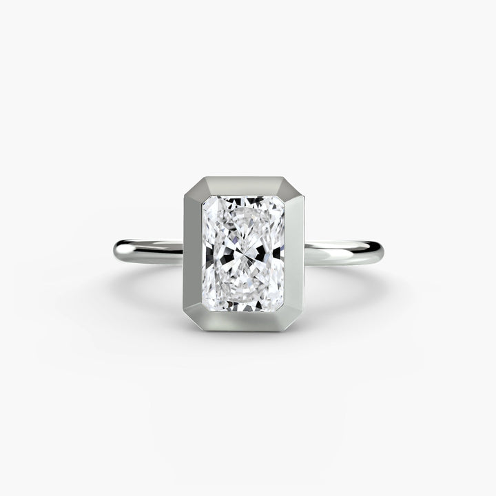The Bezel Set Solitaire in setting by 18 KARATS