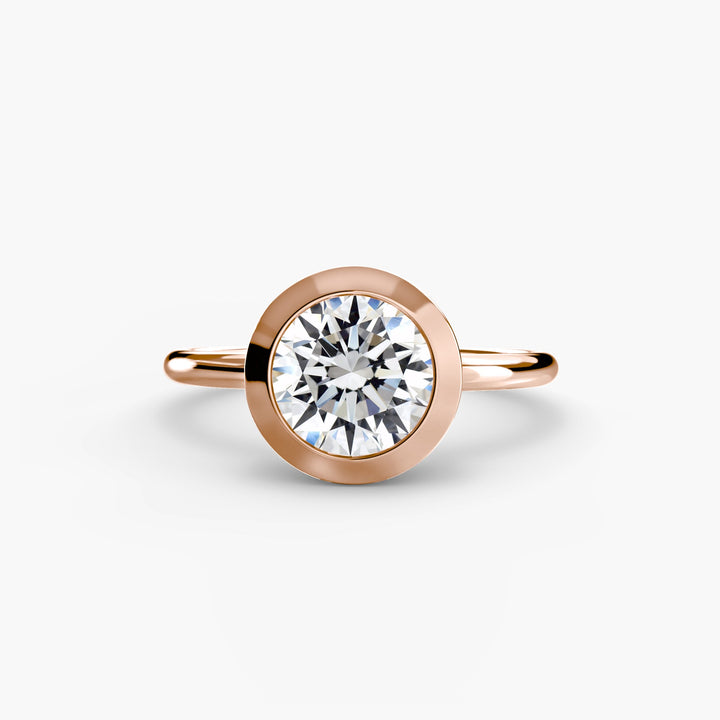 The Bezel Set Solitaire in setting by 18 KARATS
