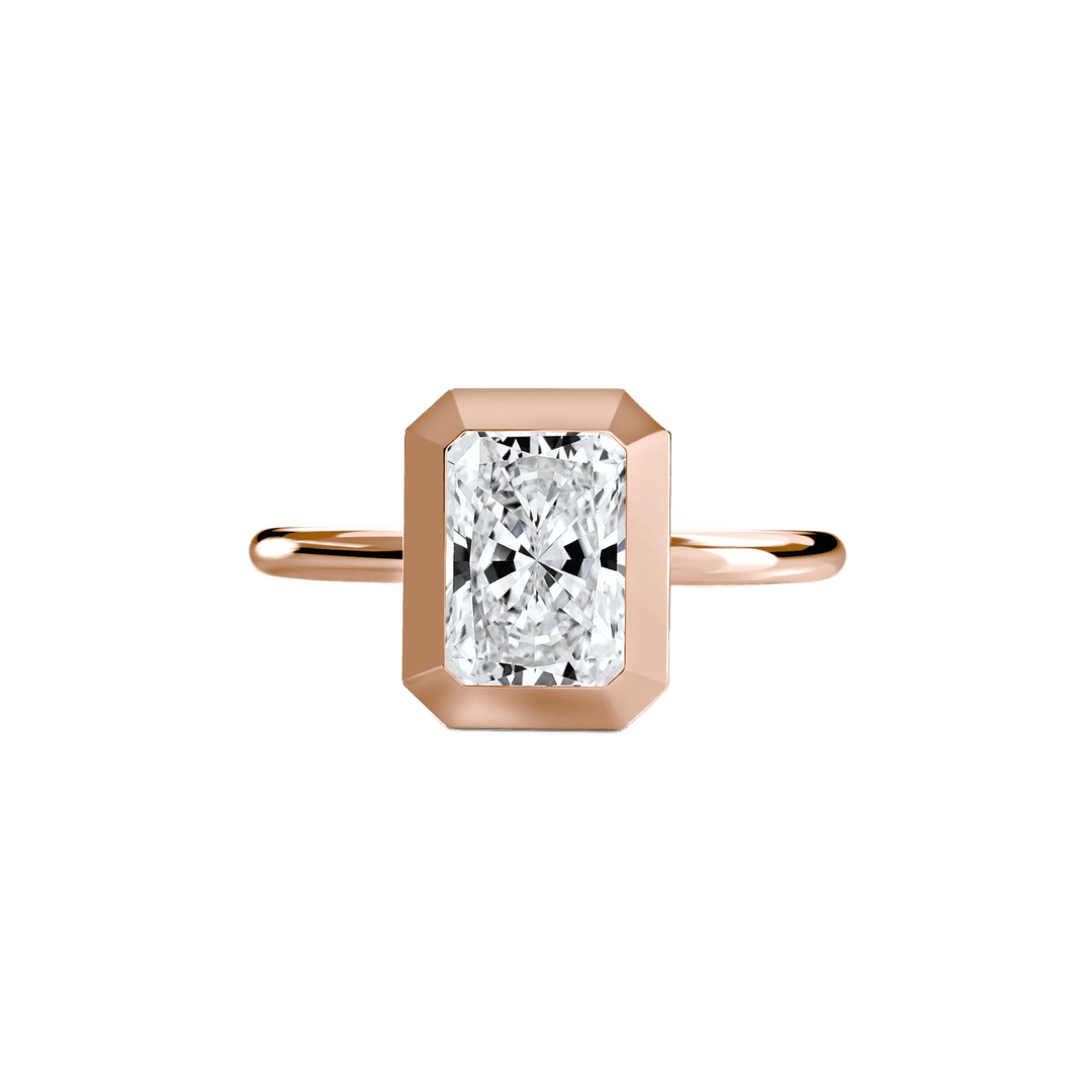 The Bezel Set Solitaire in setting by 18 KARATS